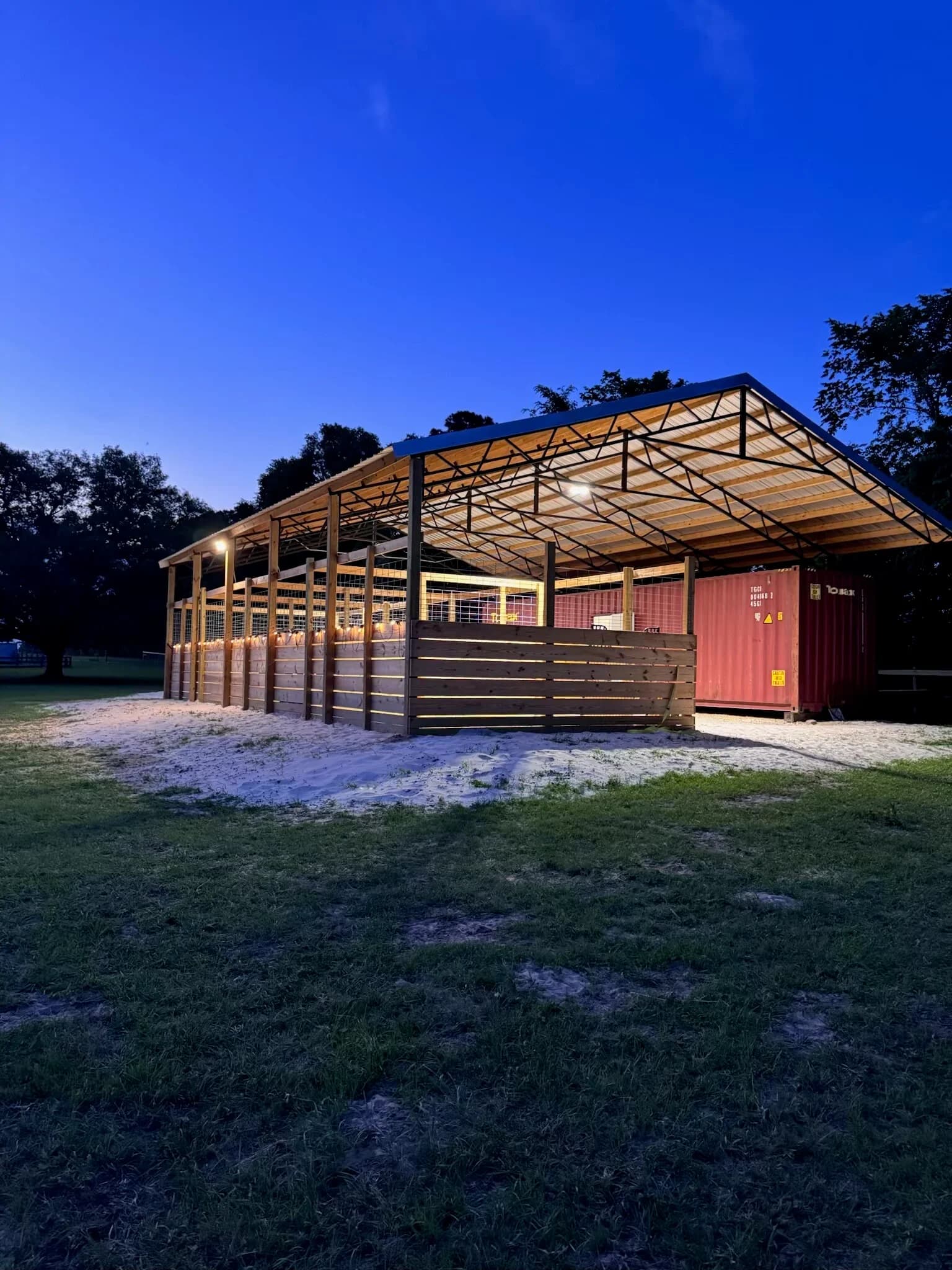 Horse stables at dusk with full LED lighting by M&M Pro